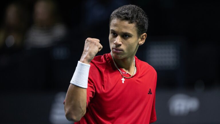 Gabriel Diallo pumps his fist. He won his first five-set match at the Australian Open on Tuesday.