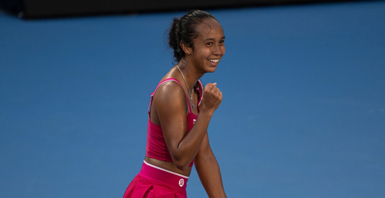 Leylah Fernandez pumps her fist and smiles. She and Felix Auger-Aliassime both advanced on Wednesday at the Australian Open.