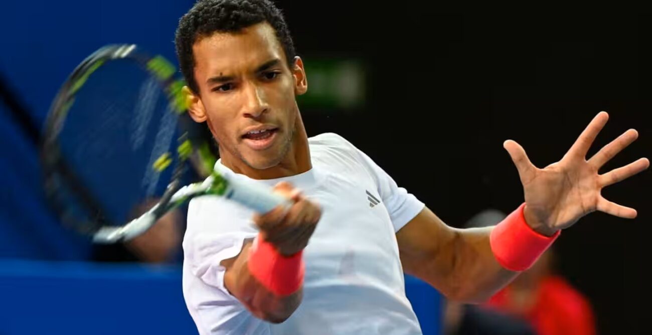 Felix Auger-Aliassime hits a forehand. He advanced to the Doha semis when Daniil Medvedev retired.