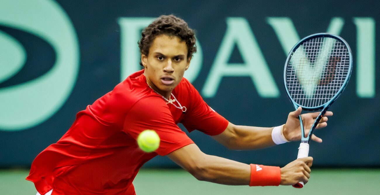 Gabriel Diallo prepares to hit a backhand volley on day one of the Davis Cup tie between Hungary and Canada.