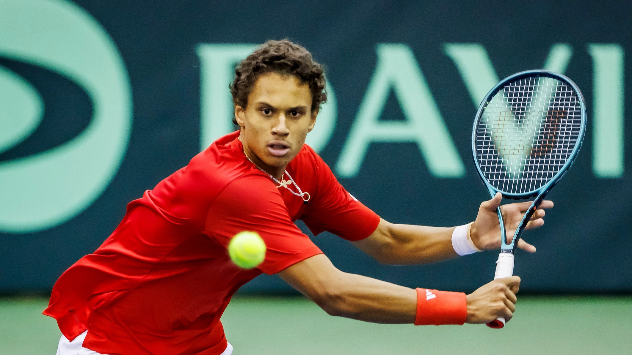 Gabriel Diallo prepares to hit a backhand volley on day one of the Davis Cup tie between Hungary and Canada.