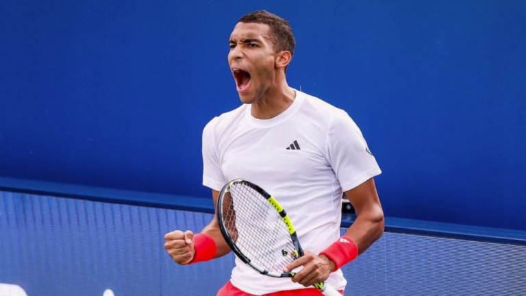 Felix Auger-Aliassime pumps his fists in Dubai. He beat Marin Cilic in the quarter-finals on Thursday.