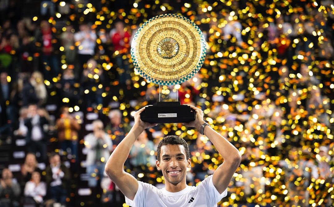 Felix Auger-Aliassime lifts the trophy, his second of 2025, in Montpellier above his head.