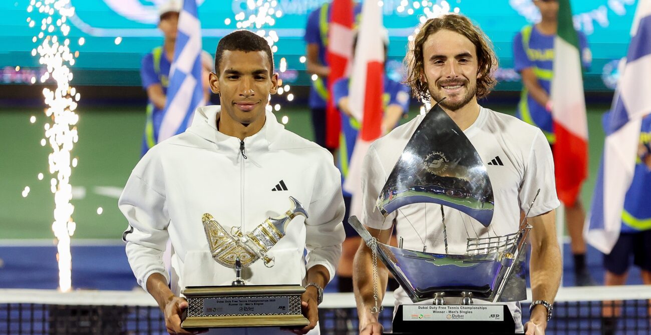 Felix Auger-Aliassime (left) and Stefanos Tsitsipas (right) hold their trophies in Dubai. Auger-Aliassime and Denis Shapovalov both had big results ahead of Indian Wells this week.