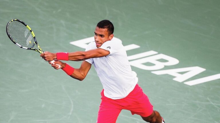 Felix Auger-Aliassime follows through on a backhand in Dubai. He lost to Stefanos Tsitsipas in the final.