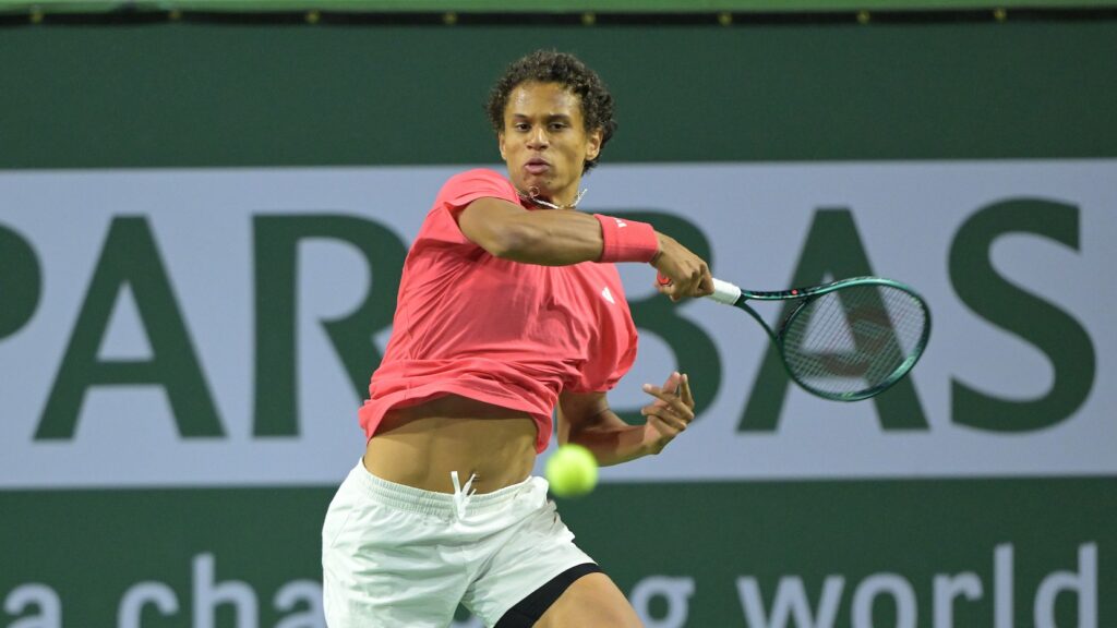 Gabriel Diallo follows through on a forehand in Indian Wells.