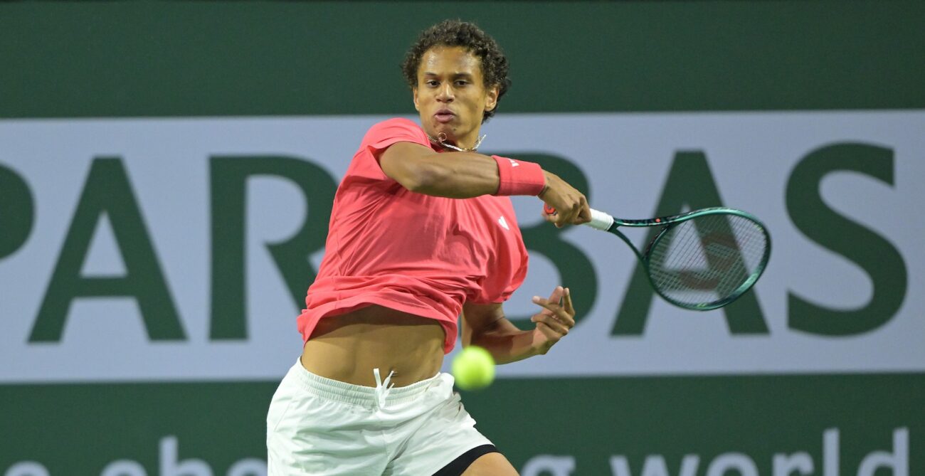 Gabriel Diallo follows through on a forehand in Indian Wells.