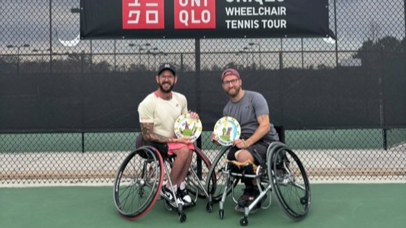 Rob Shaw (right) and Heath Davidson (left) hold up their trophies after winning the wheelchair quad doubles title in Rome, Georgia, Shaw's first title of 2025.