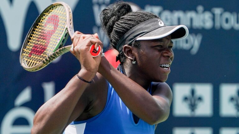 Victoria Mboko follows through on a backhand. She won her first WTA match in Miami on Wednesday.